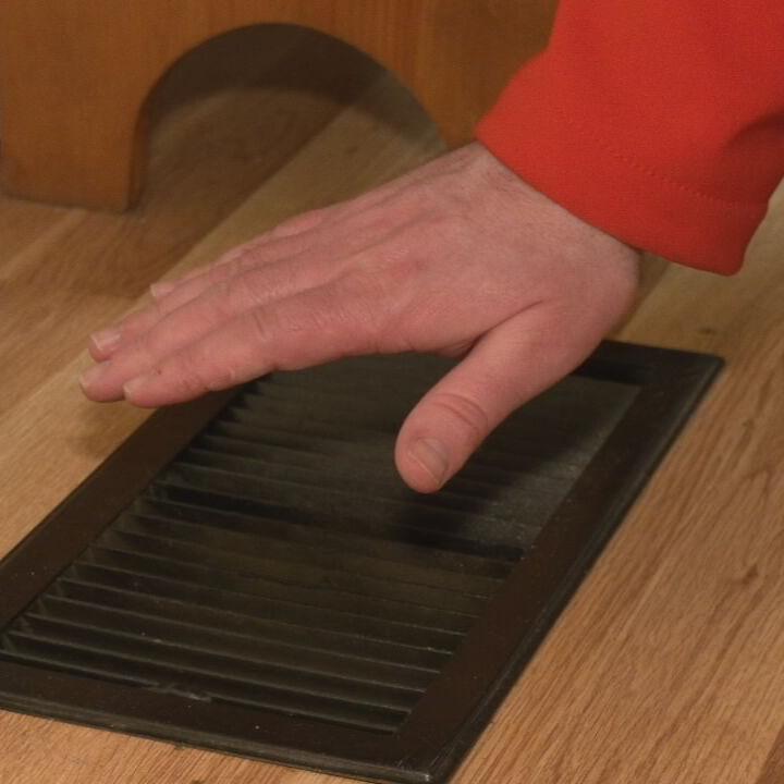 Heat vent in floor of home.jpeg
